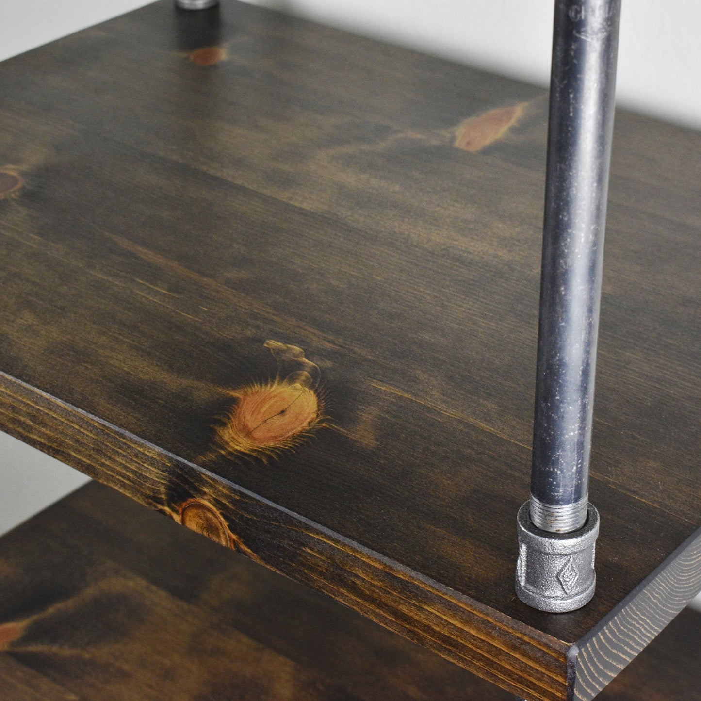 Up close photo of one shelf measuring 14 inches deep - detail photo to show smoothness of shelves and solid wood construction, finish in a dark brown stain by Minwax, handmade shelving by JT Industrial Designs